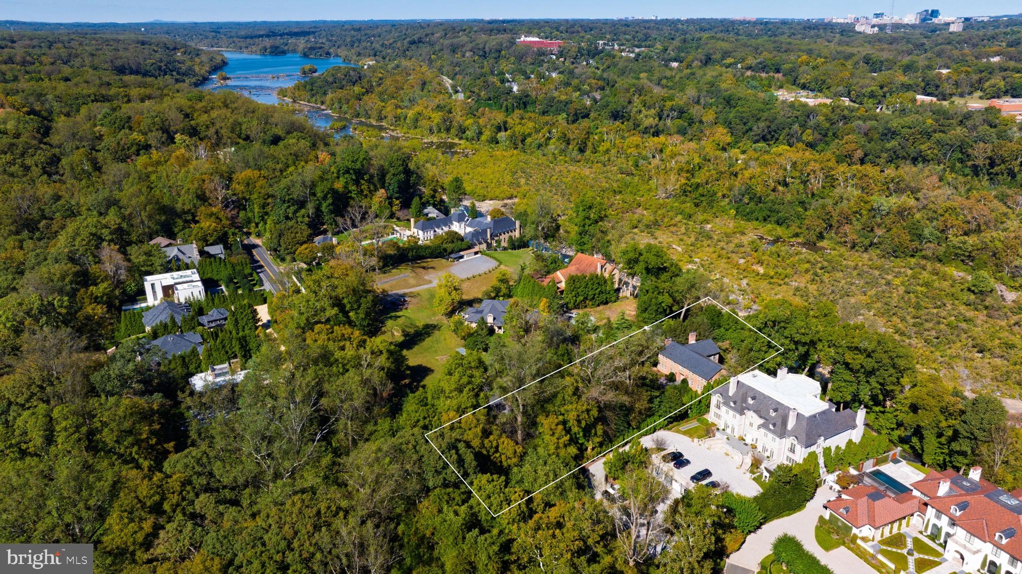 221 Chain Bridge Road McLean, VA 22101 - Photo 17 of 18 an aerial view of a houses with a lush green hillside
