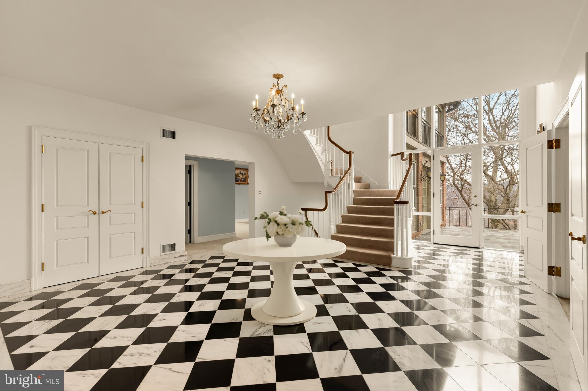 221 Chain Bridge Road McLean, VA 22101 - Photo 7 of 18 a living room with a black white checkered floor with couches chair and a coffee table