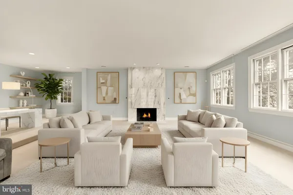 a dining room with wooden floor a chandelier a wooden table and chairs