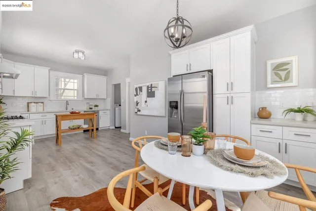 a view of kitchen and dining area with furniture