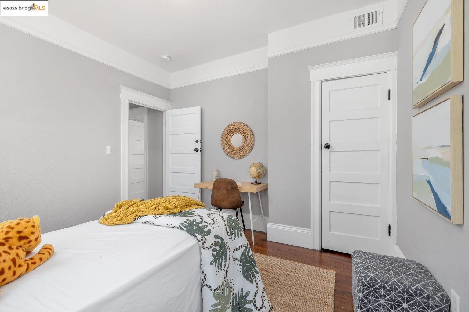 1837 7th Avenue Oakland, CA 94606 - Photo 19 of 42 a bedroom with a bed and a dresser