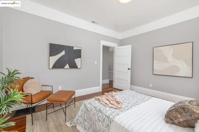 a bedroom with a bed and a chair