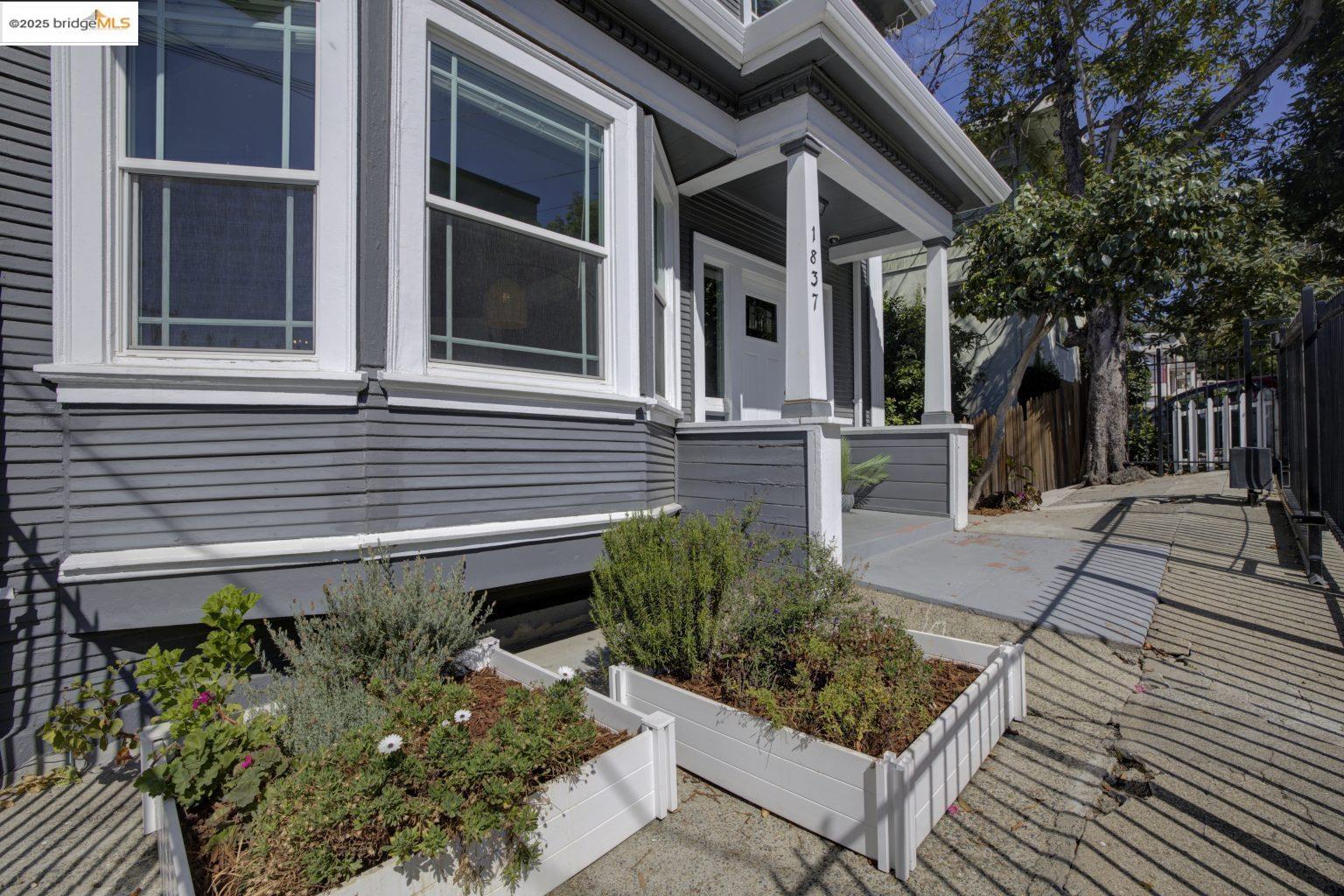 1837 7th Avenue Oakland, CA 94606 - Photo 31 of 42 a front view of a house with garden