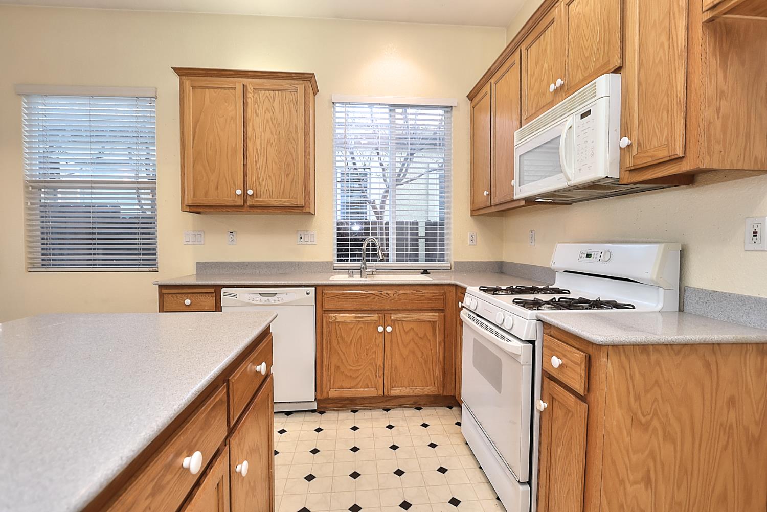 331 Unity Circle Sacramento, CA 95833 - Photo 30 of 77 a kitchen with stainless steel appliances a stove a sink and a refrigerator