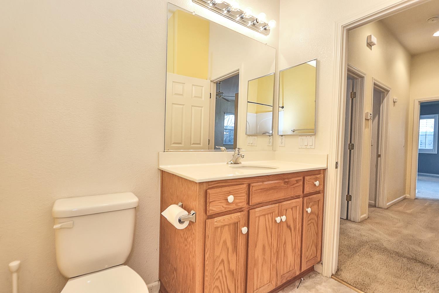 331 Unity Circle Sacramento, CA 95833 - Photo 37 of 77 a bathroom with a toilet a sink a mirror and a shower