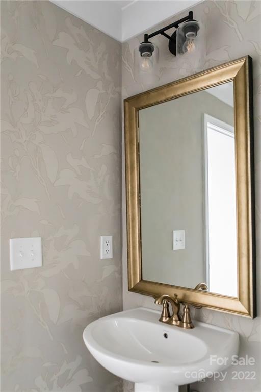 541 Madison Falls Court Fort Mill, SC 29708 - Photo 15 of 25 a bathroom with a sink and a mirror