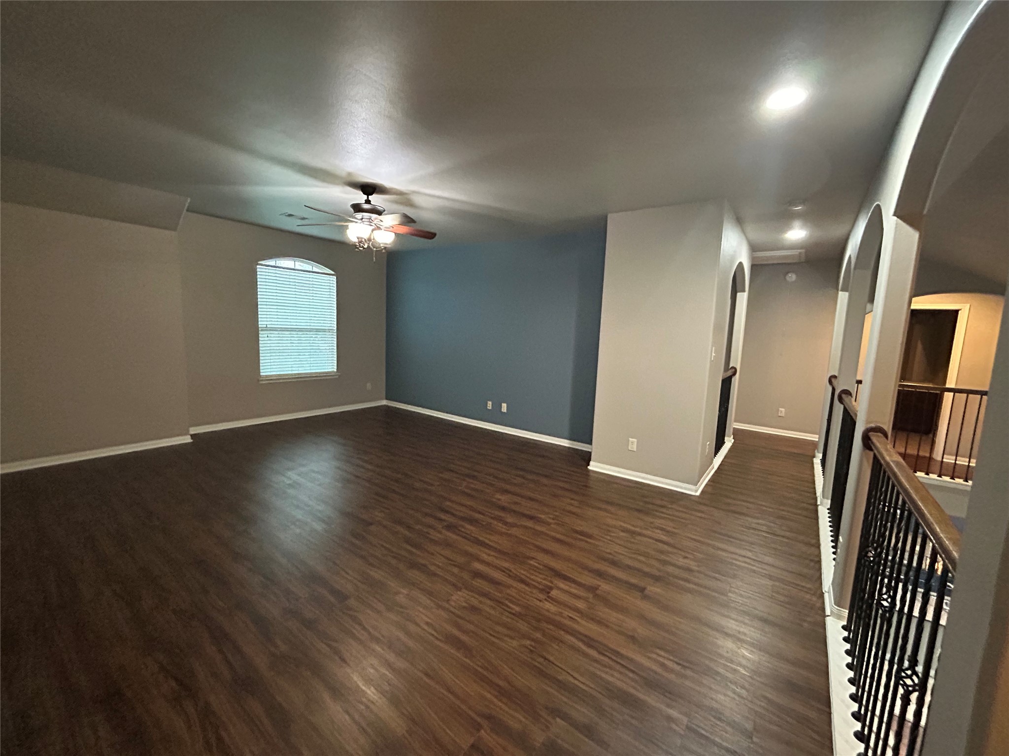 7936 Lake Commons Drive Rosenberg, TX 77469 - Photo 25 of 33 an empty room with wooden floor and windows