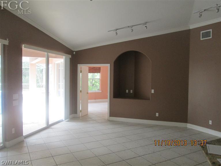 14225 Collier Boulevard Naples, FL 34119 - Photo 2 of 4 an empty room with windows