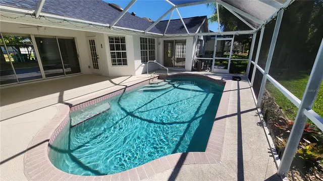 a view of a house with backyard porch and sitting area