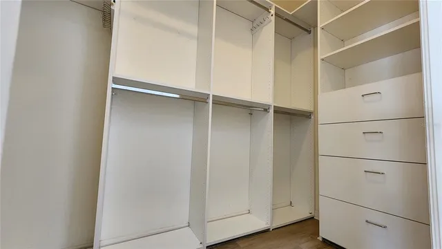 a view of an empty walk in closet