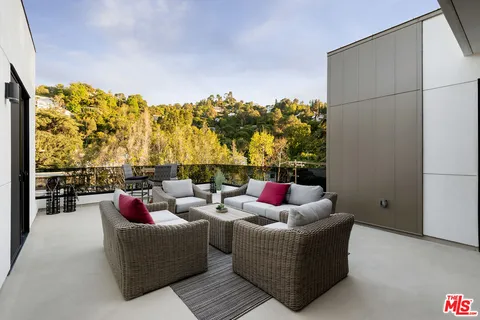 a living room with furniture and a couch