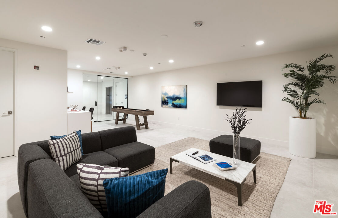 3649 Regal Place, Unit 503 Los Angeles, CA 90068 - Photo 39 of 40 a living room with furniture and a flat screen tv