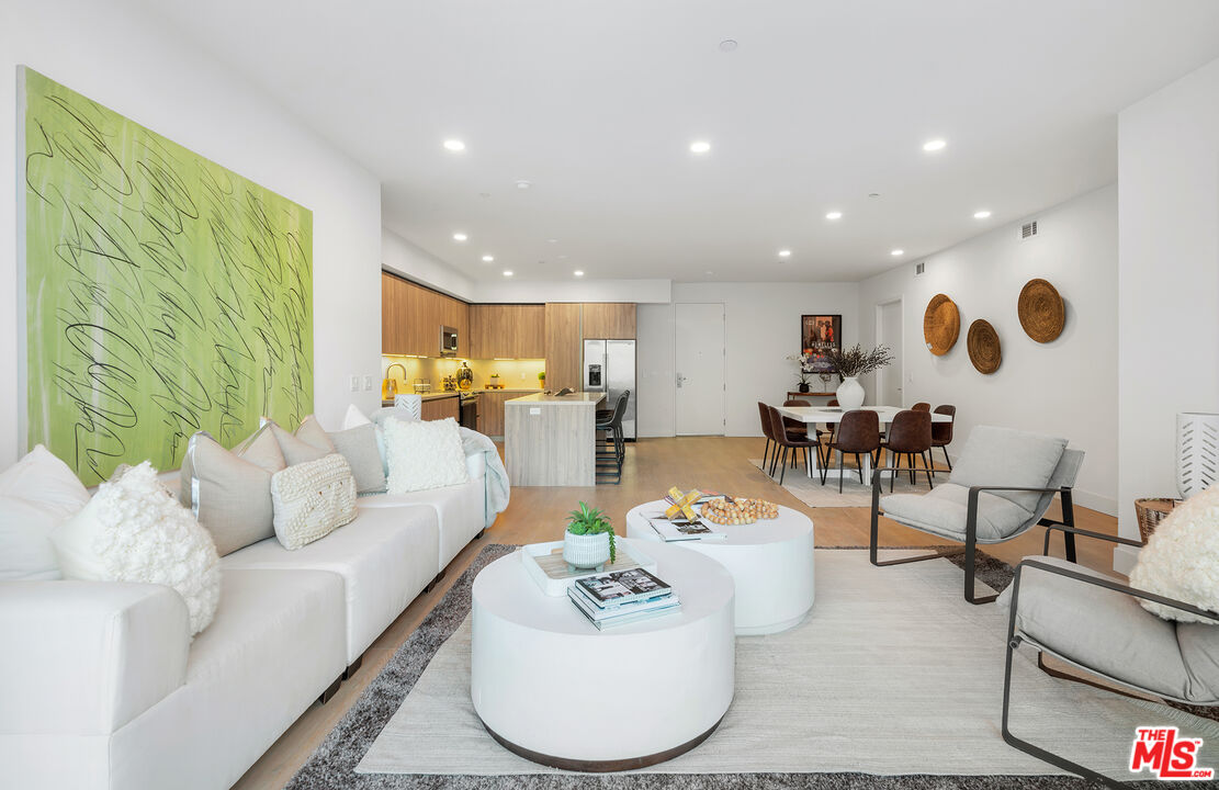 3649 Regal Place, Unit 503 Los Angeles, CA 90068 - Photo 9 of 40 a living room with furniture and a large window