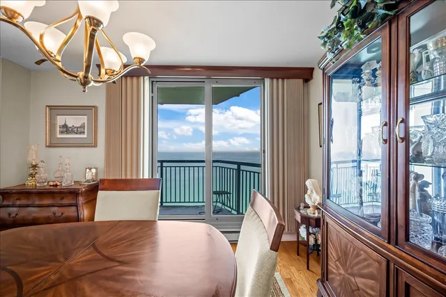 a bedroom with furniture and a large window