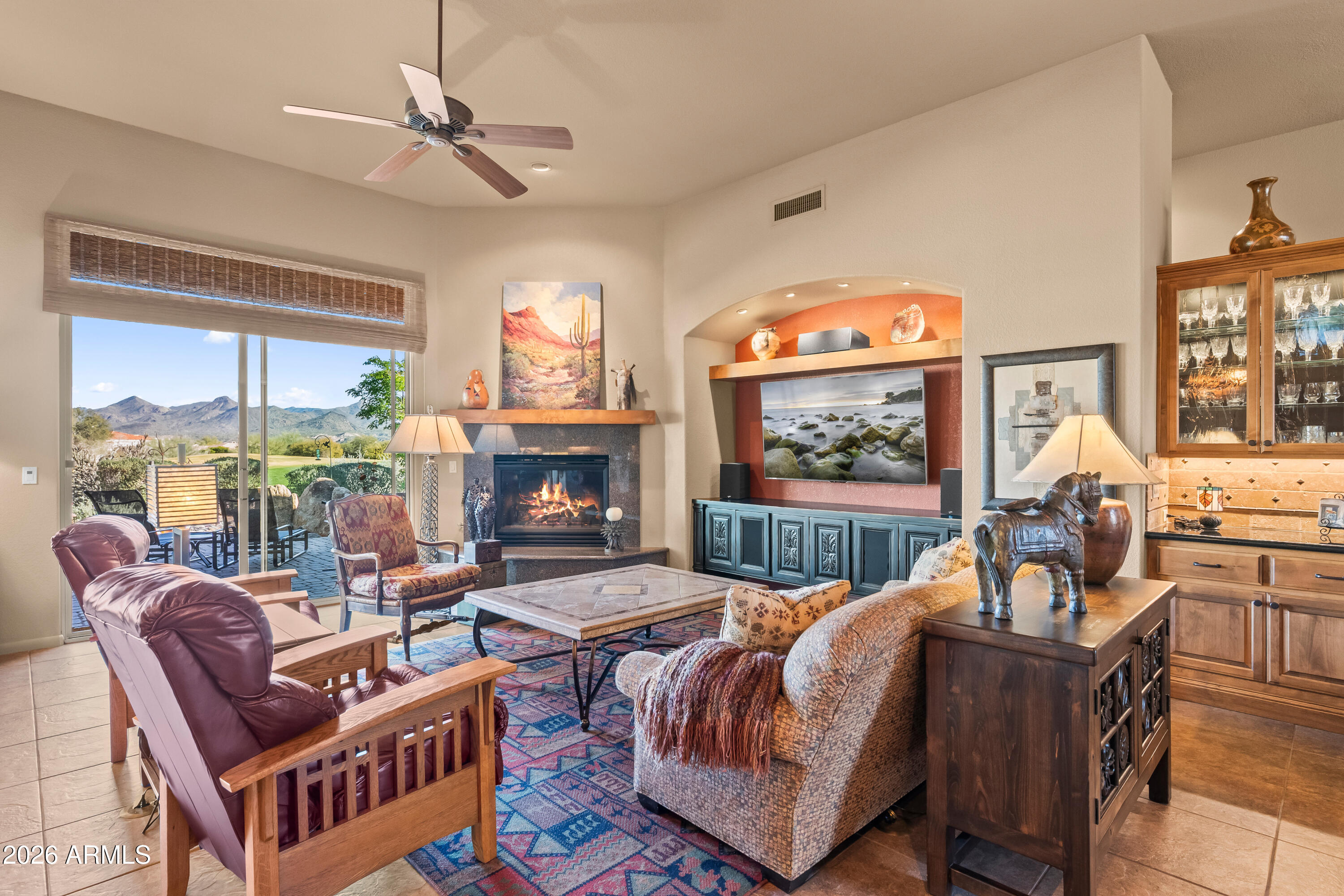 18926 East Quartz Way Rio Verde, AZ 85263 - Photo 10 of 44 Gas fireplace and TV wall