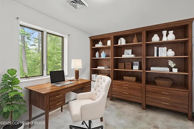 a living room with furniture and a window