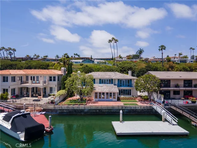 a aerial view of a house with swimming pool and a yard