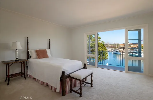 a bed room with a bed and a chair