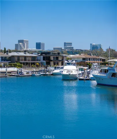 a view of a lake with cars parked