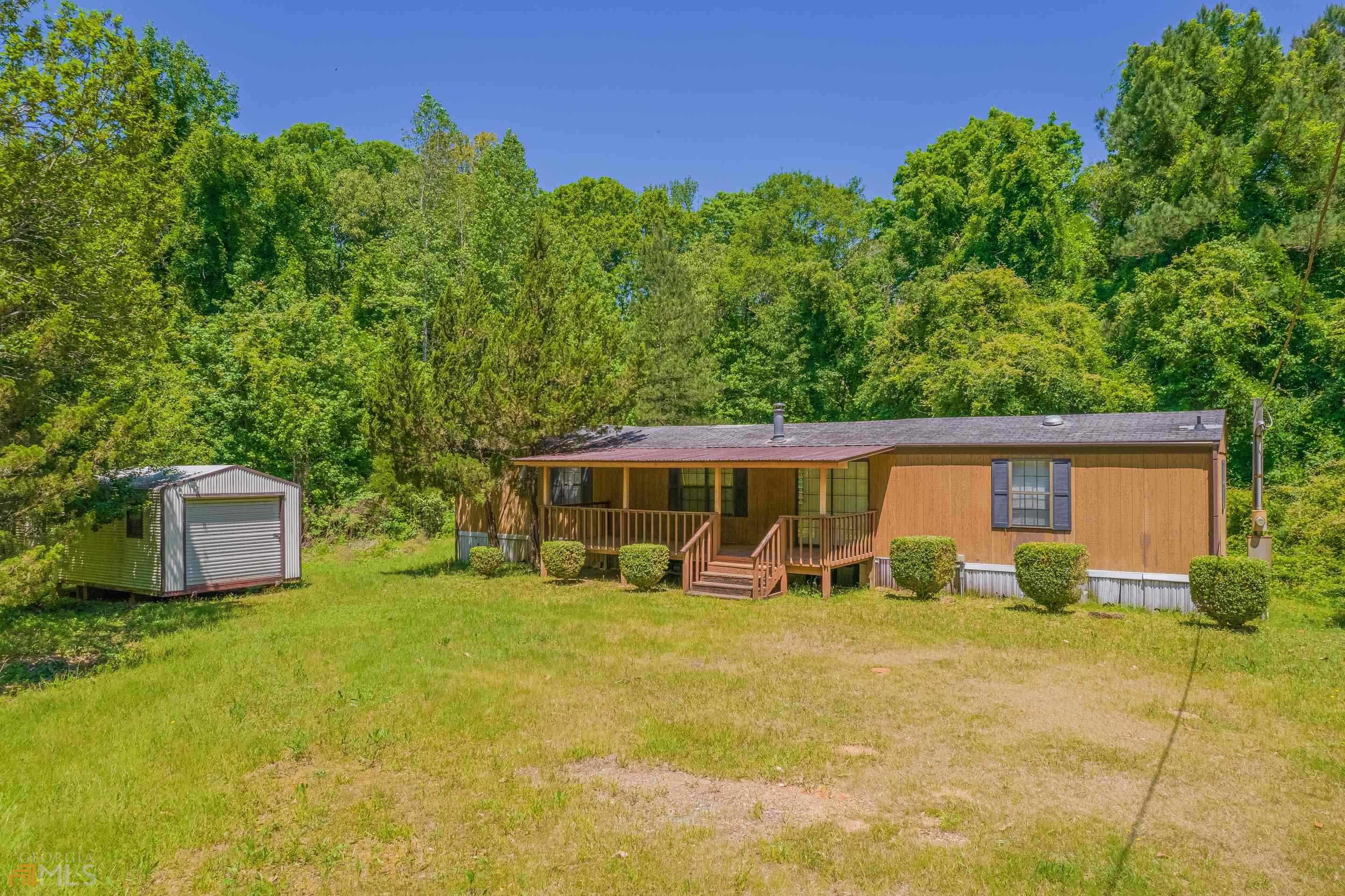 89 Three Angles Road Comer, GA 30629 - Photo 1 of 1 a view of a house with yard and sitting area