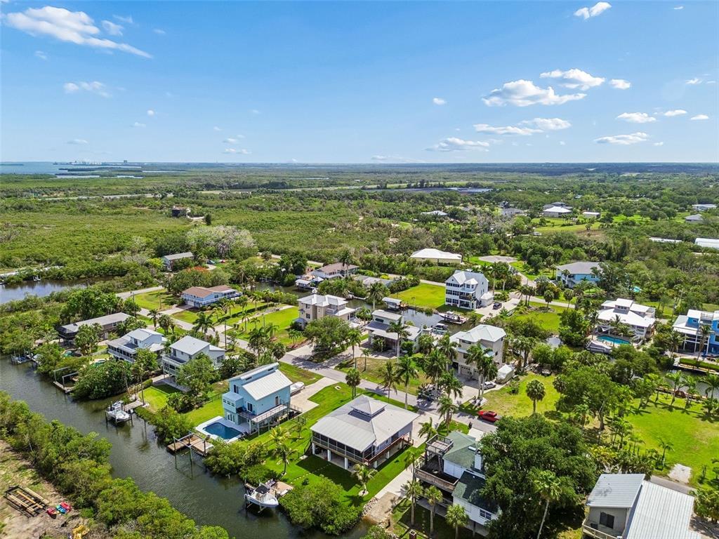 119 Burns Road Terra Ceia, FL 34250 - Photo 100 of 100 an aerial view of residential houses with outdoor space and trees
