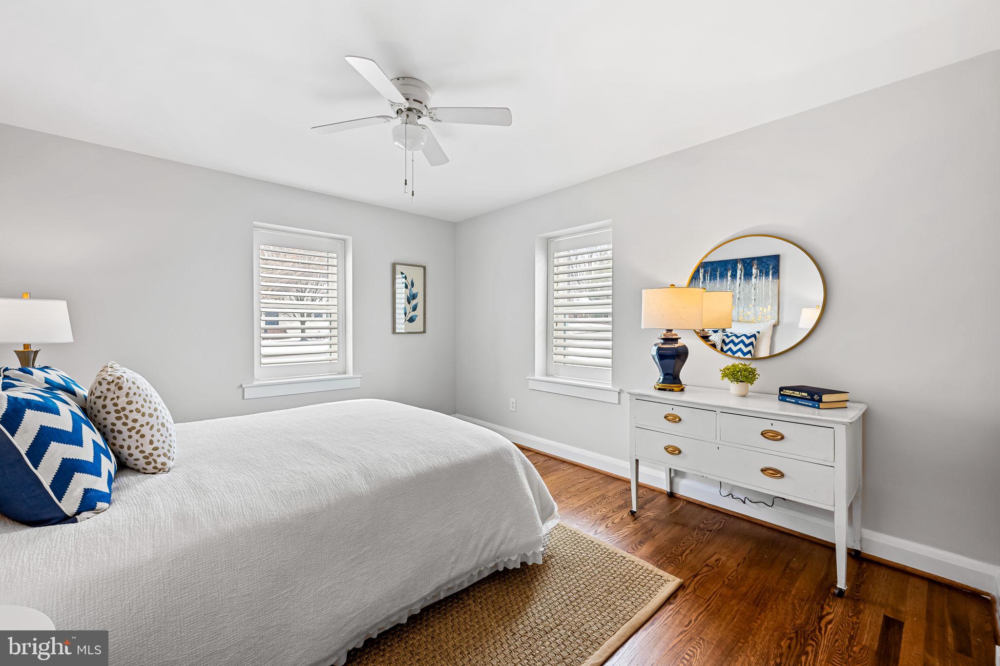 440 Cleveland Road Linthicum Heights, MD 21090 - Photo 14 of 28 a bedroom with a bed and a chandelier