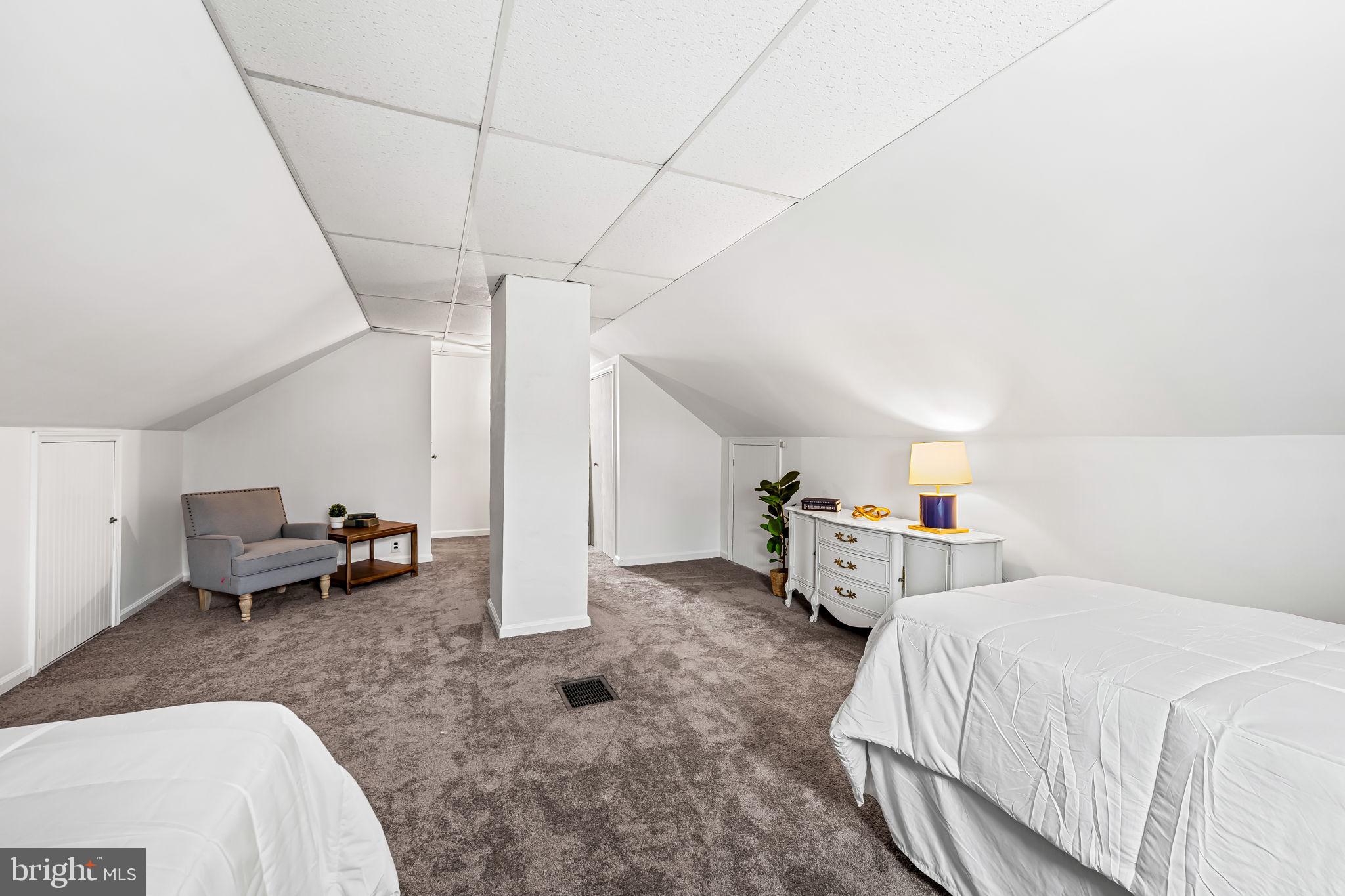 440 Cleveland Road Linthicum Heights, MD 21090 - Photo 21 of 28 a bed room with a bed and a chair