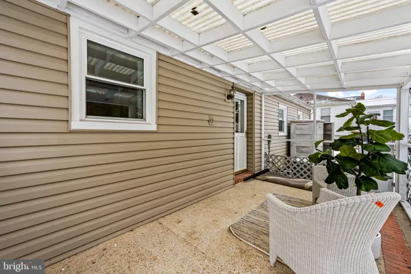 a view of a porch with furniture