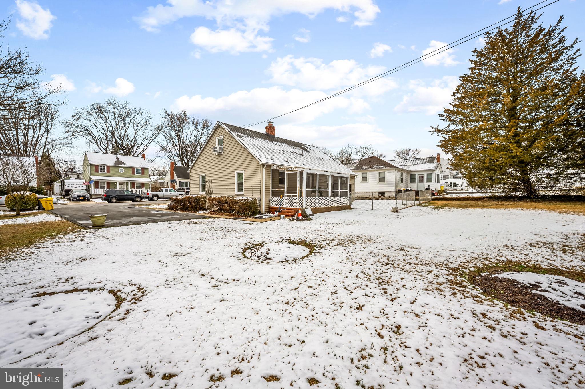 440 Cleveland Road Linthicum Heights, MD 21090 - Photo 27 of 28 a view of residential houses with snow on the road