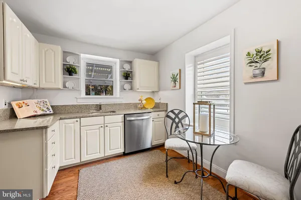 a kitchen with a cabinets and chairs
