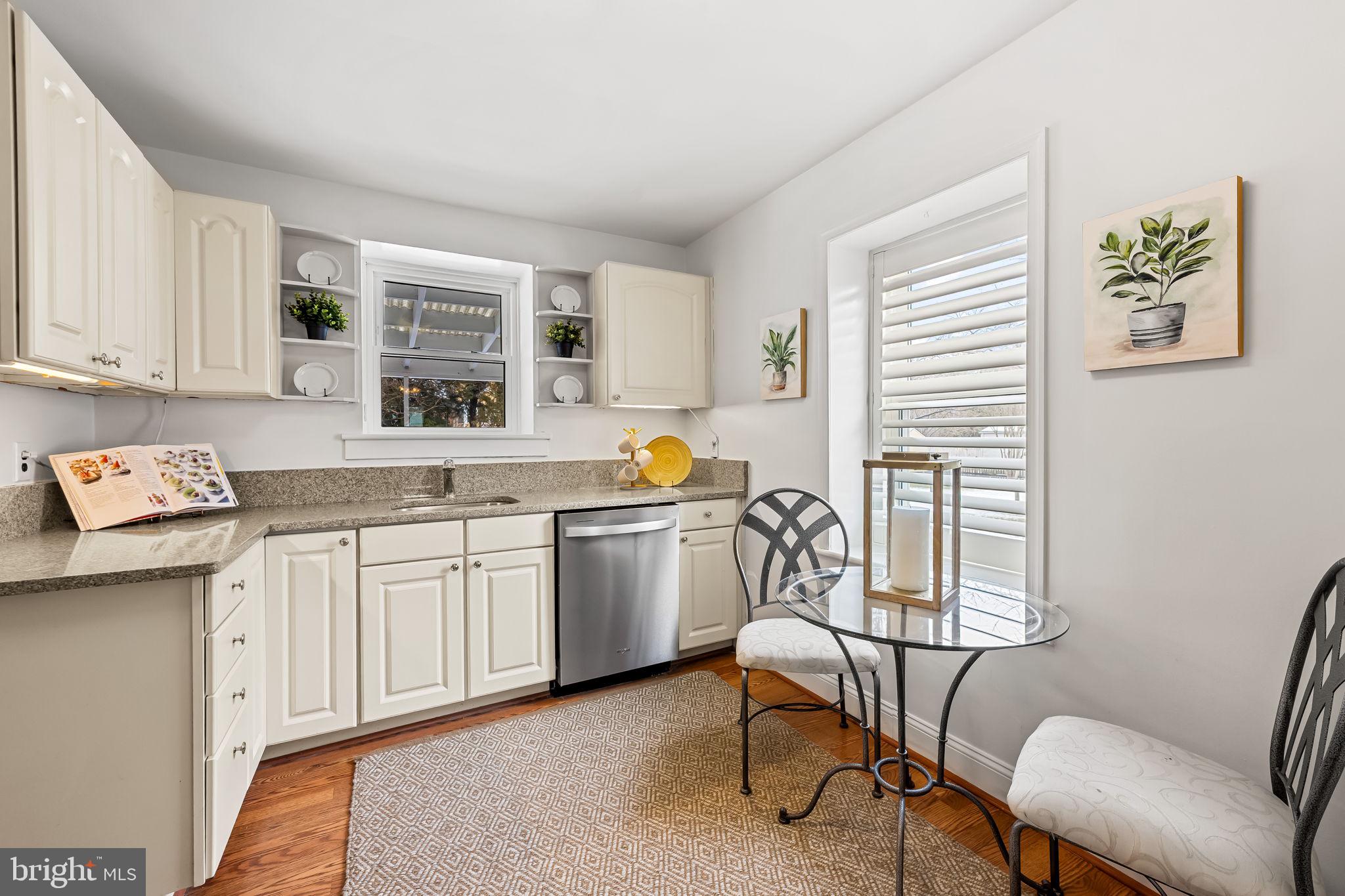 440 Cleveland Road Linthicum Heights, MD 21090 - Photo 9 of 28 a kitchen with a cabinets and chairs
