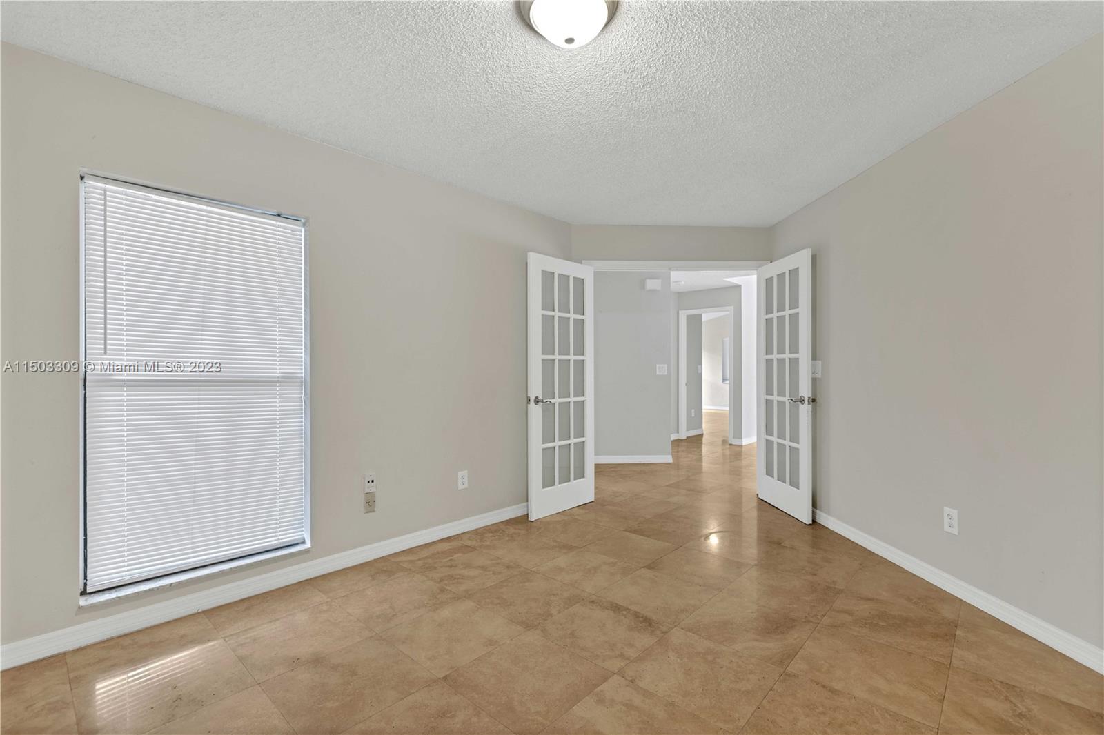6242 Sweet Maple Lane Boca Raton, FL 33433 - Photo 13 of 31 an empty room with windows