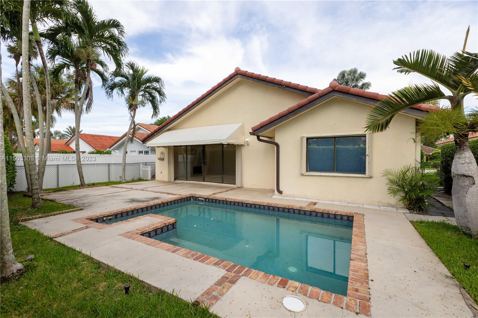 6242 Sweet Maple Lane Boca Raton, FL 33433 - Photo 24 of 31 a front view of a house with a garden and a garage