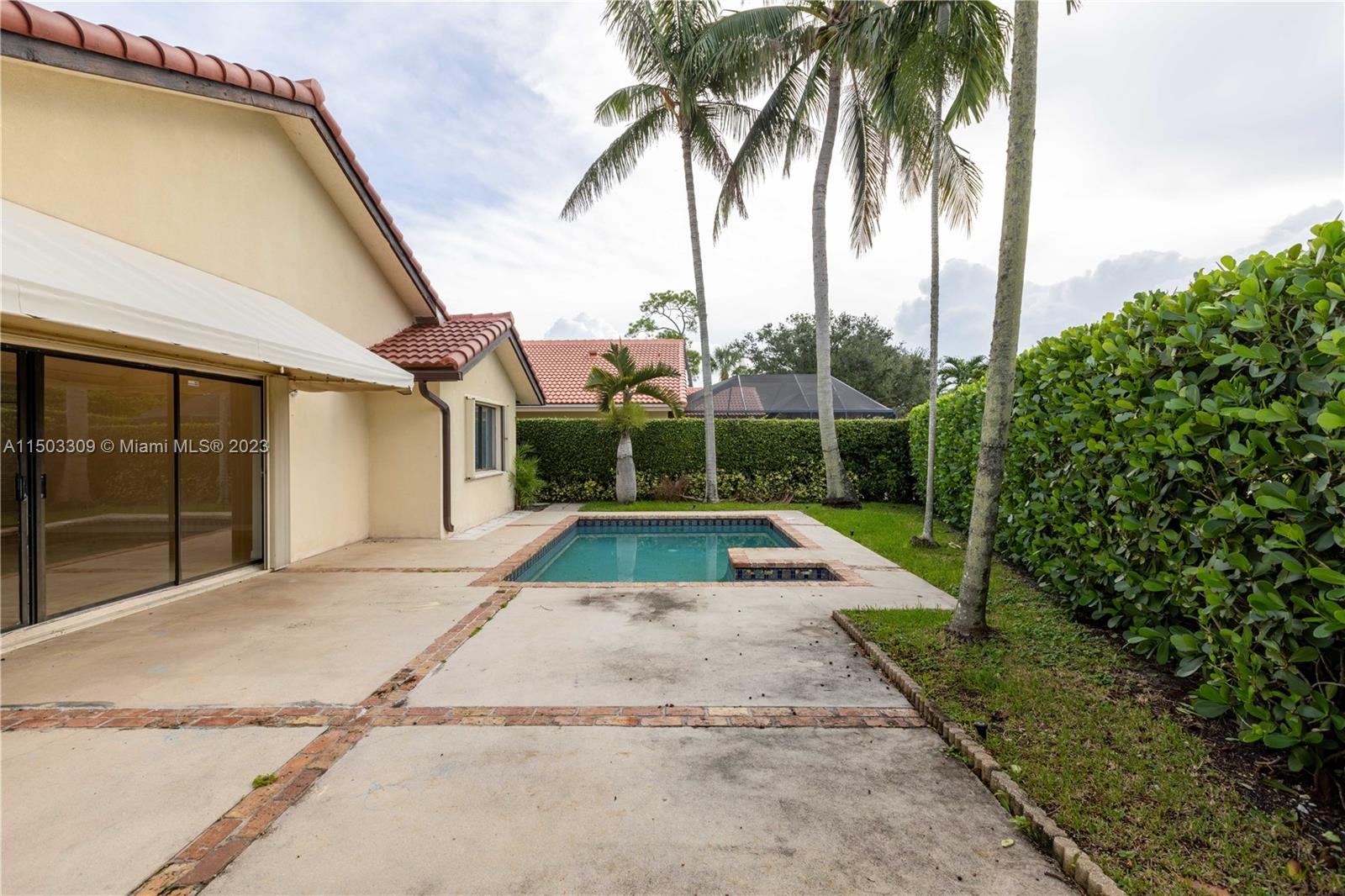 6242 Sweet Maple Lane Boca Raton, FL 33433 - Photo 27 of 31 a view of backyard with swimming pool and outdoor seating