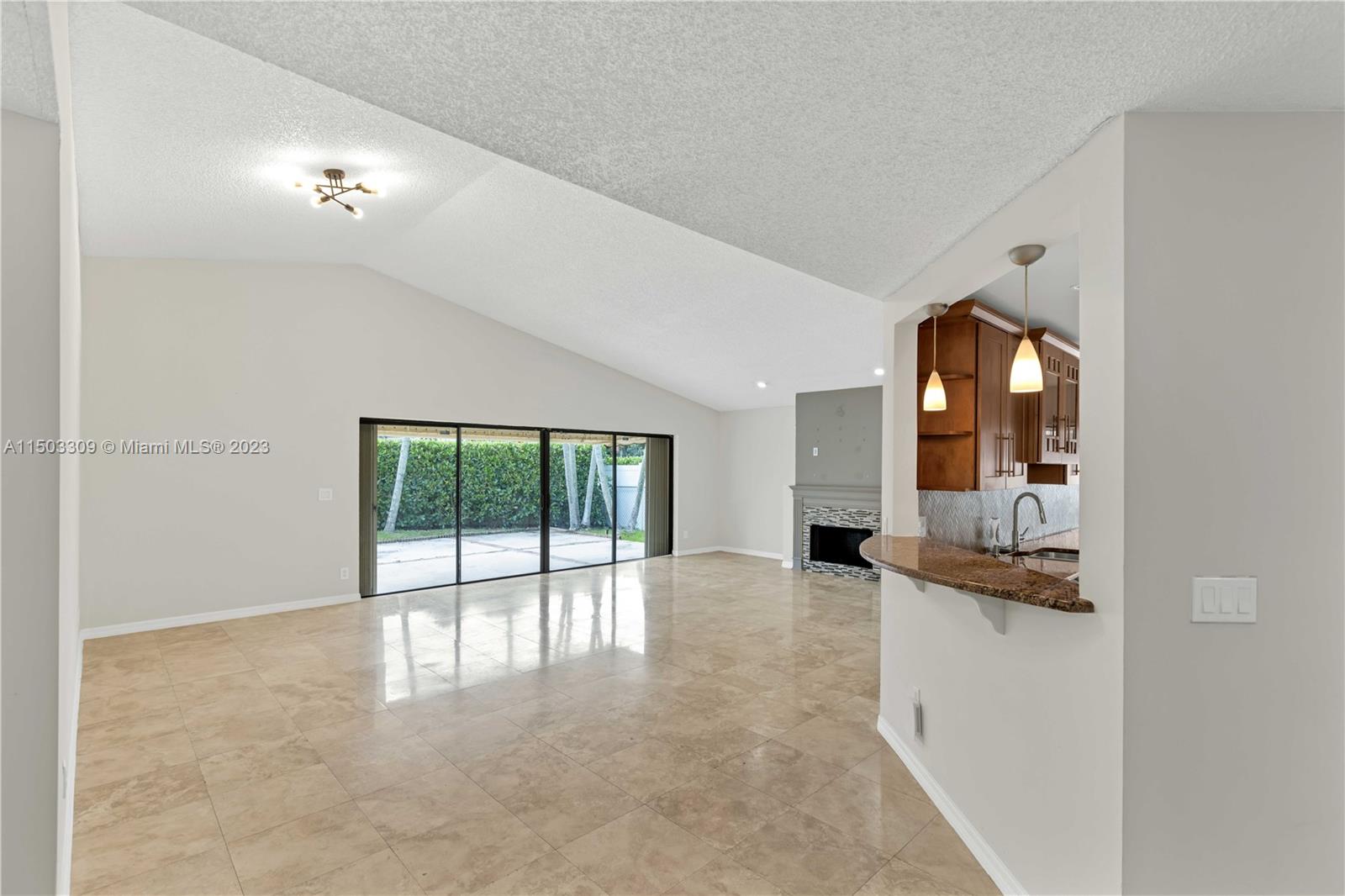 6242 Sweet Maple Lane Boca Raton, FL 33433 - Photo 3 of 31 wooden floor in an empty room with a large window