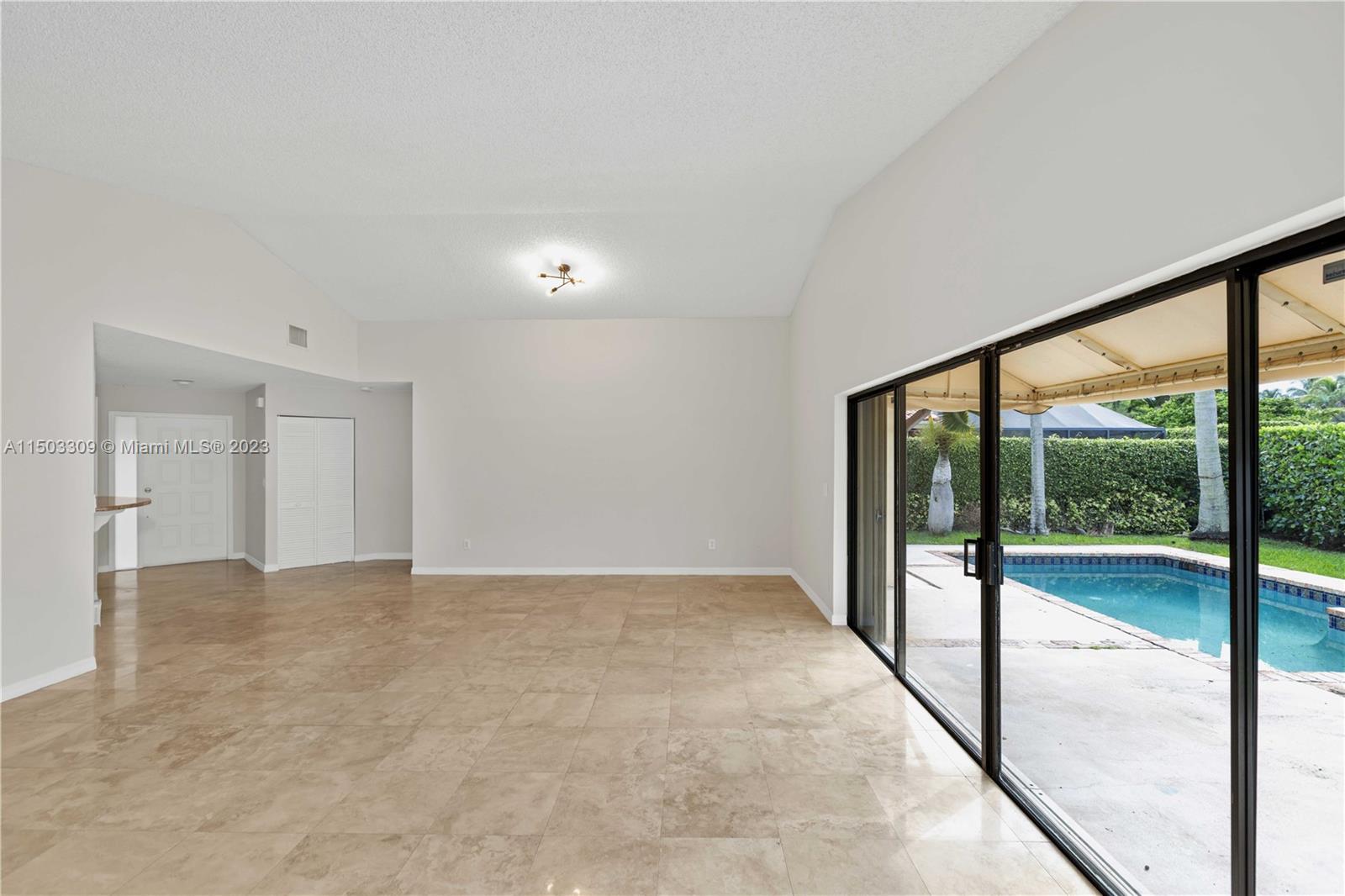 6242 Sweet Maple Lane Boca Raton, FL 33433 - Photo 4 of 31 a view of an empty room with a large window