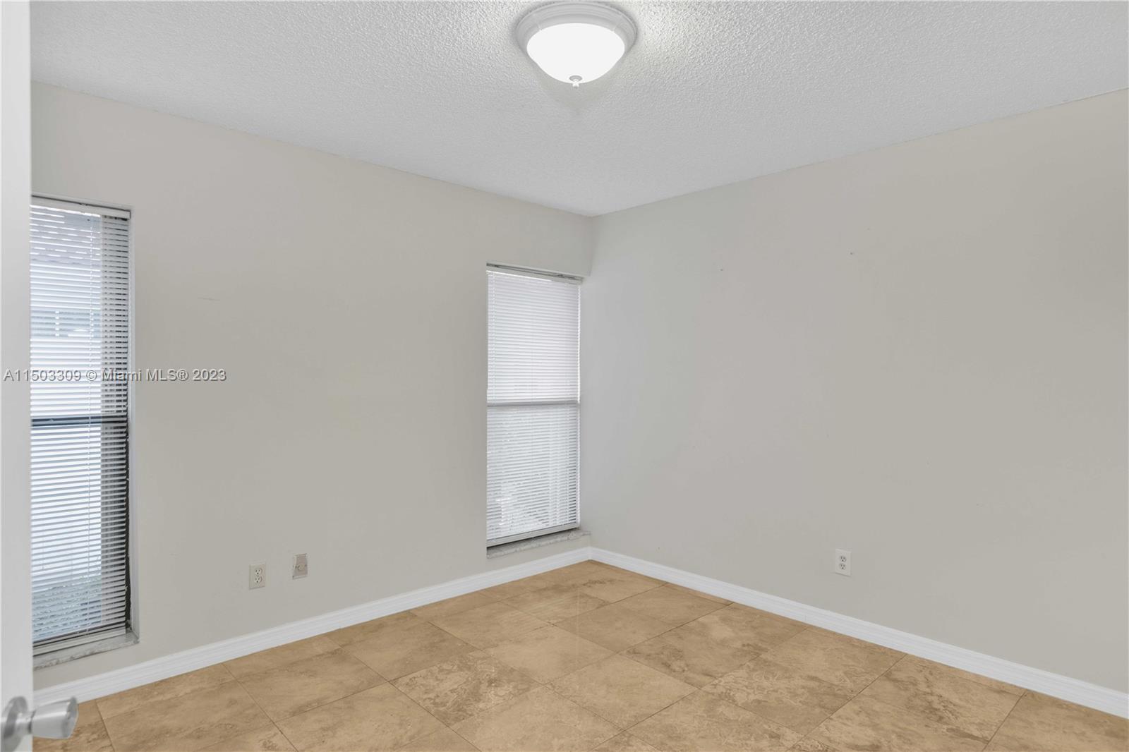 6242 Sweet Maple Lane Boca Raton, FL 33433 - Photo 9 of 31 an empty room with a empty space and windows