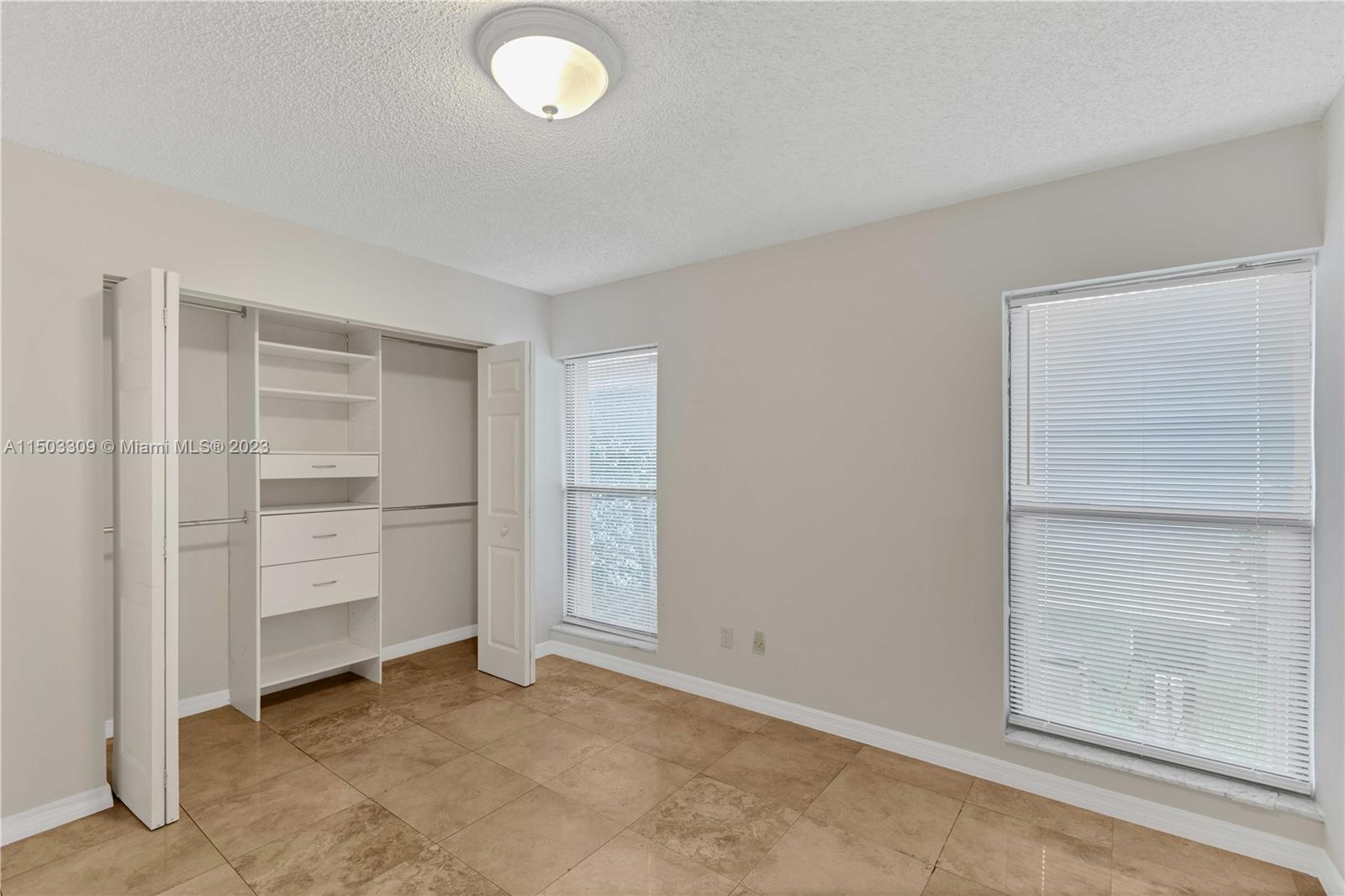 6242 Sweet Maple Lane Boca Raton, FL 33433 - Photo 10 of 31 an empty room with closet