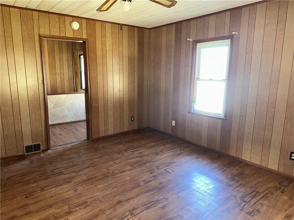 1423 Maratta Road Aliquippa, PA 15001 - Photo 14 of 22 an empty room with wooden floor and windows