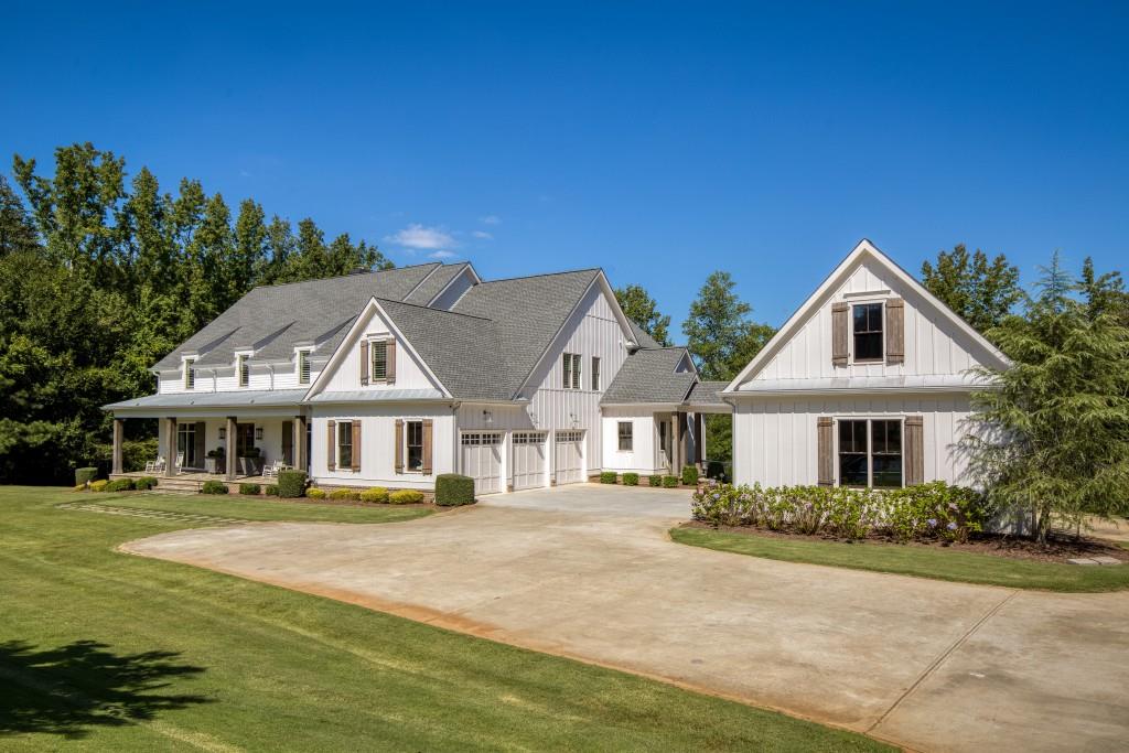 13235 Arnold Mill Road Roswell, GA 30075 - Photo 2 of 72 a front view of a house with a yard