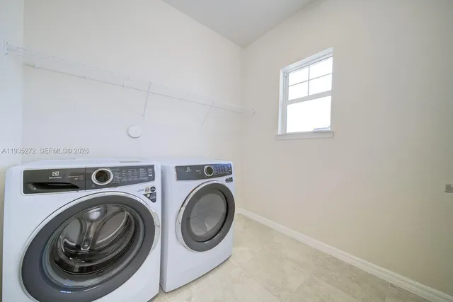a utility room with dryer and washer