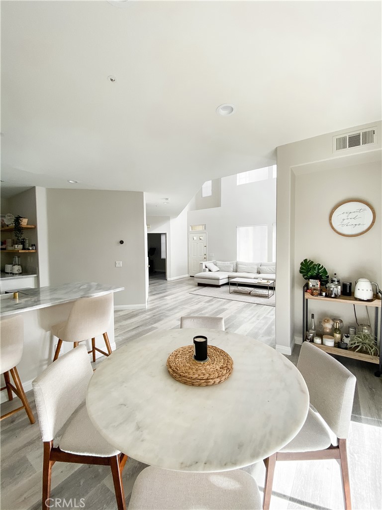 151 Islington Irvine, CA 92620 - Photo 2 of 15 a kitchen with a table and chairs in it
