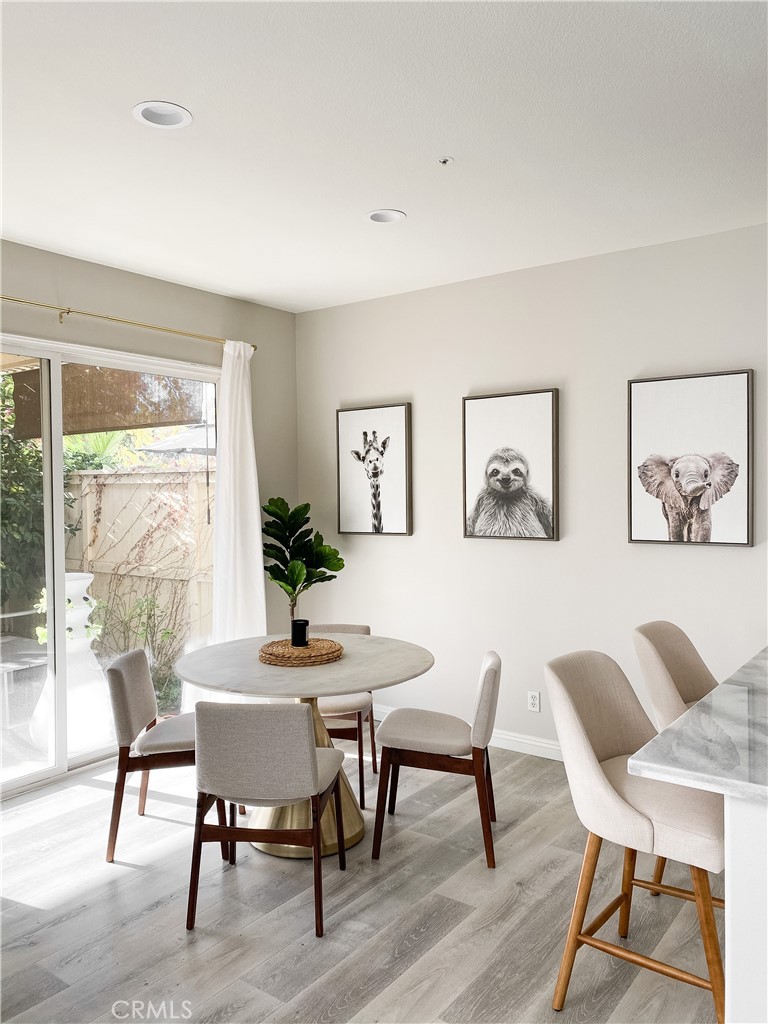 151 Islington Irvine, CA 92620 - Photo 3 of 15 a view of a dining room with furniture window and wooden floor