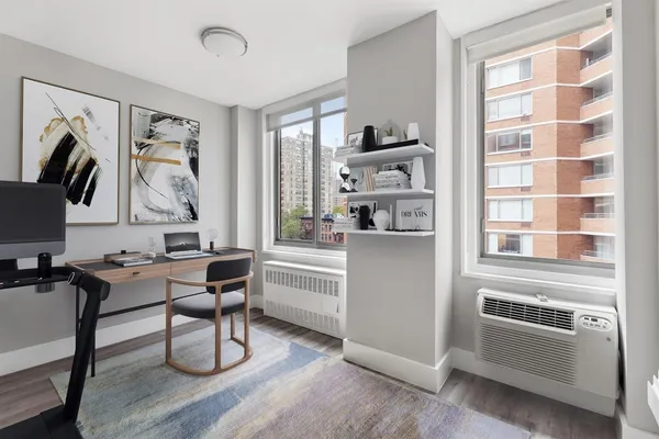 a workspace with furniture and window