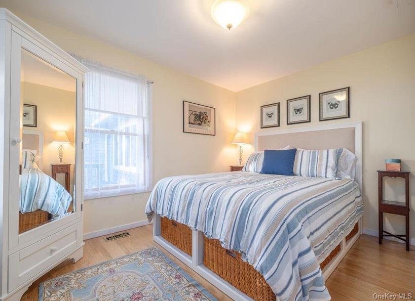 1020 Ruch Lane Southold, NY 11971 - Photo 13 of 35 a bedroom with a bed and a window