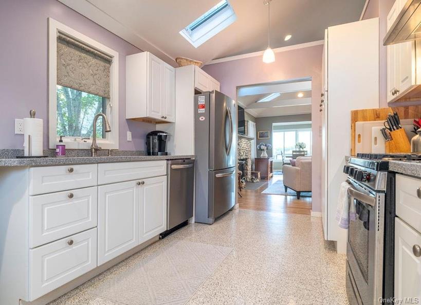 1020 Ruch Lane Southold, NY 11971 - Photo 18 of 35 a kitchen with cabinets and window