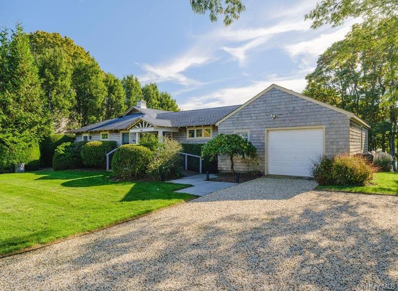 1020 Ruch Lane Southold, NY 11971 - Photo 2 of 35 a front view of a house with garden