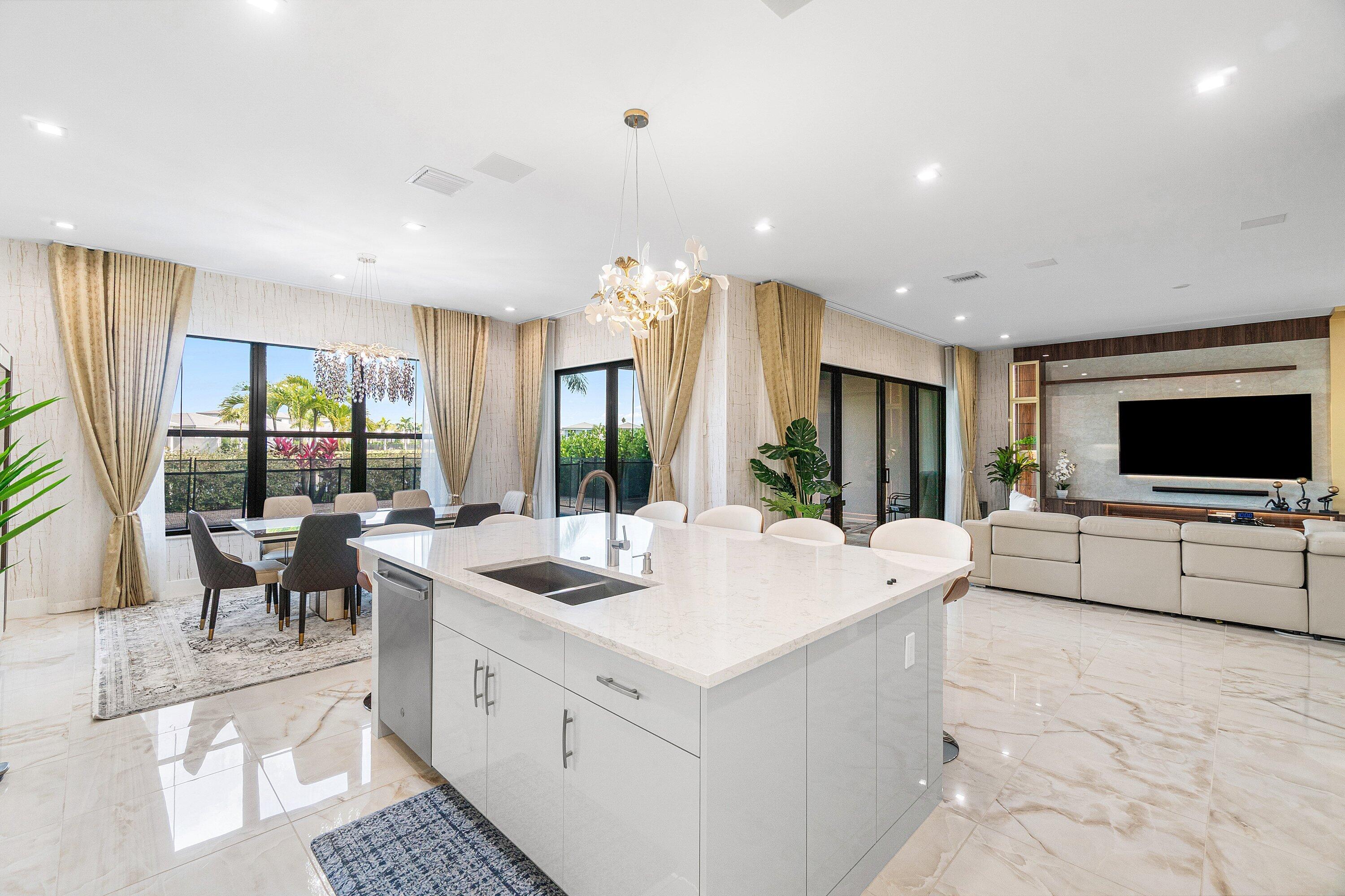 8233 Crystal Downs Avenue Boca Raton, FL 33434 - Photo 16 of 58 a large white kitchen with a large window