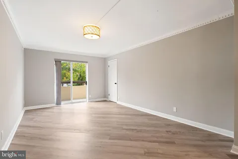 a view of an empty room and window