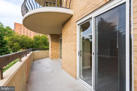 a view of balcony with wooden floor